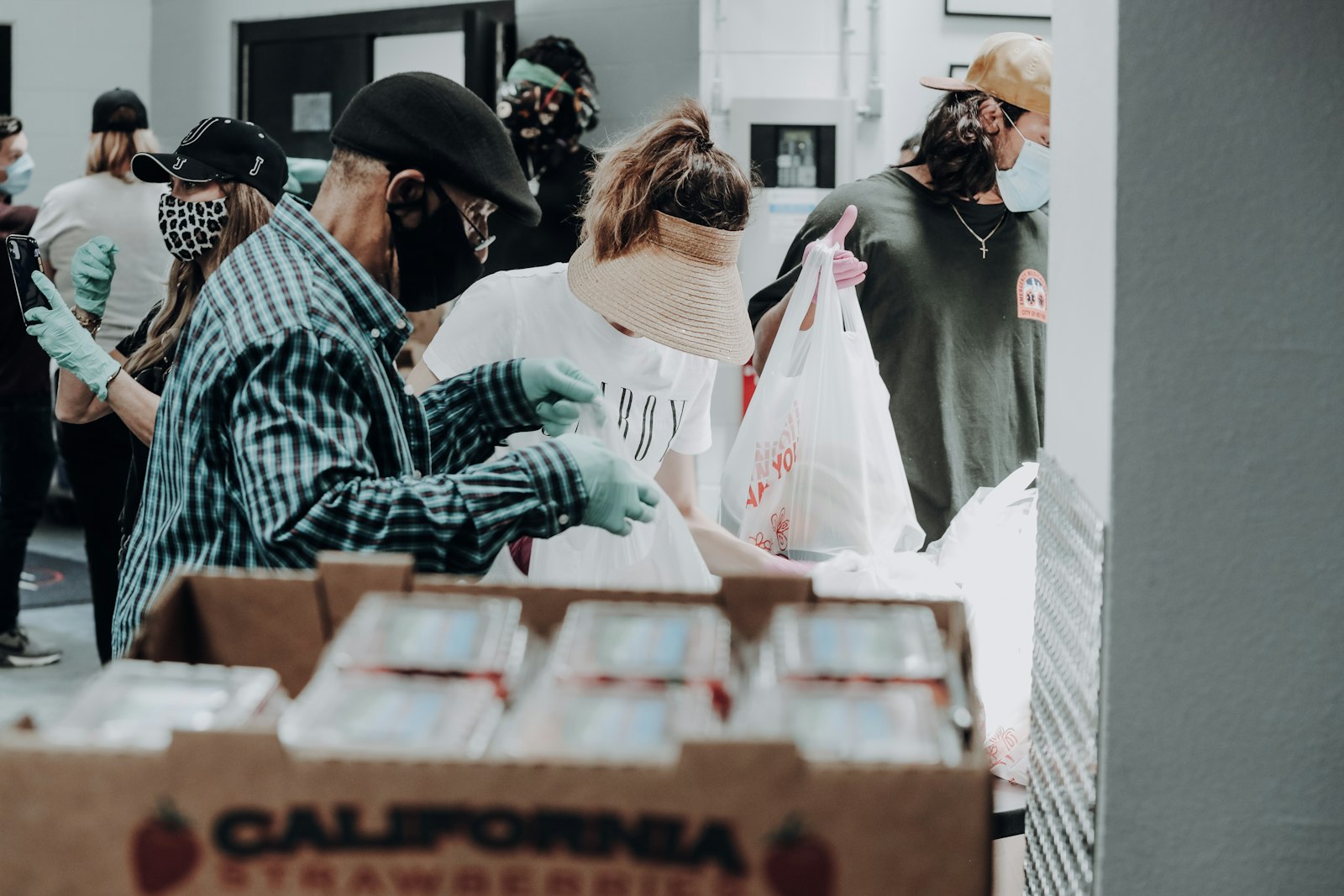 Volunteers packing supplies to give back to the community